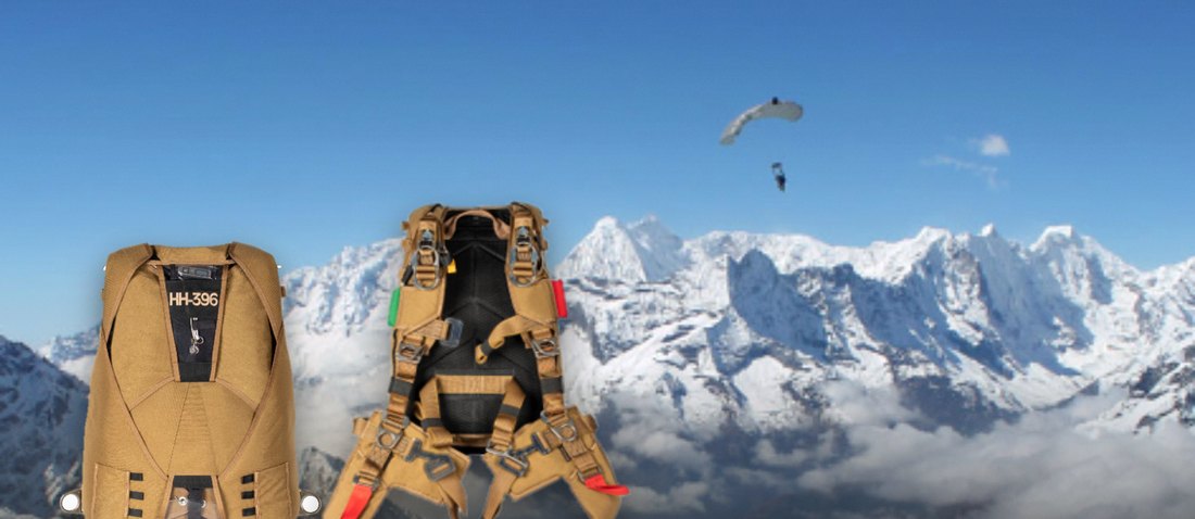 HH Container — HH-396 harness and container with high-altitude canopies over mountains