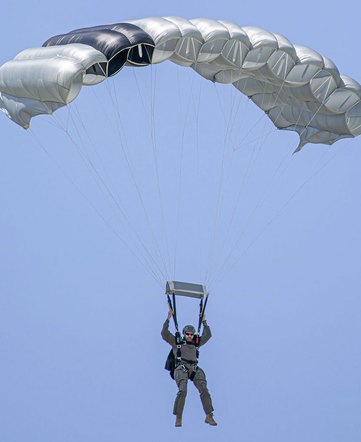 Tactical Main (TM) Series — jumper under a seven-cell tactical ram-air canopy on final approach