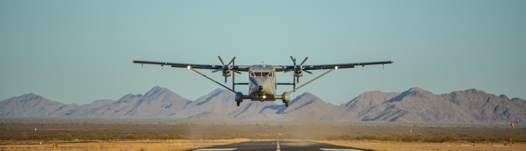 Tactical Training Facility, Coolidge Arizona — Short Skyvan jump aircraft lifting off the desert runway