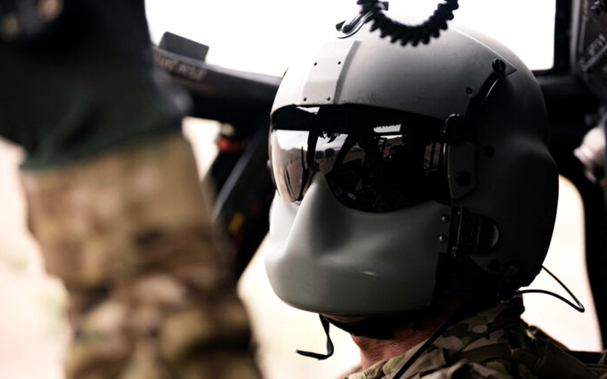 Rotary-wing aircrew helmet with visor lowered in the cabin