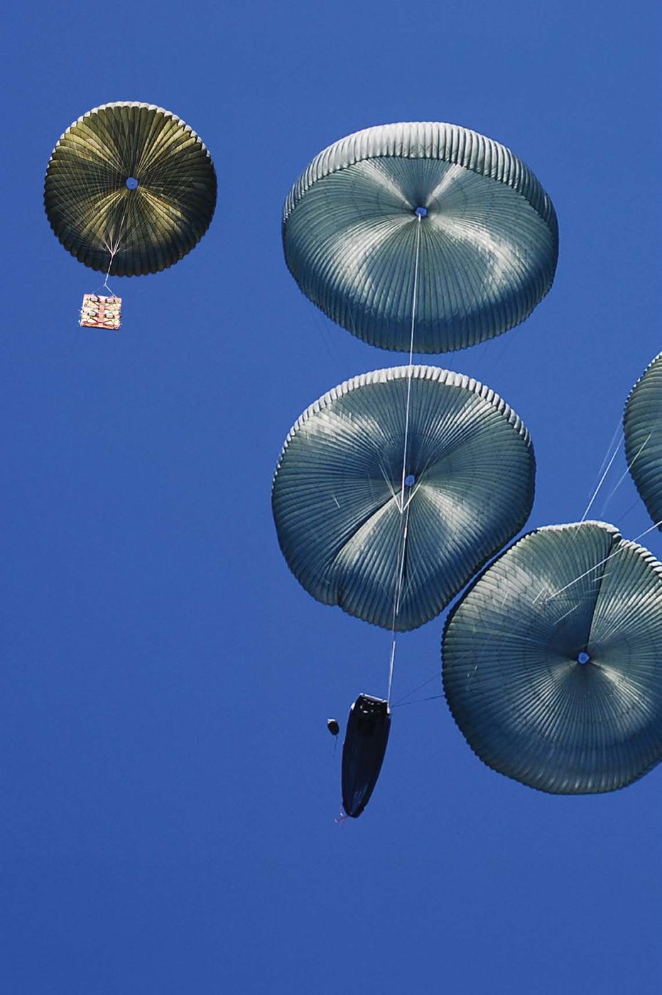 Multiple cargo canopies in descent